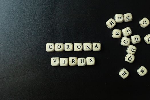 The corona virus  wooden cube  on black background for medical content.