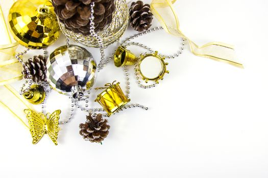 Christmas golden and silver decorations on white background. Basket weave on table top view.