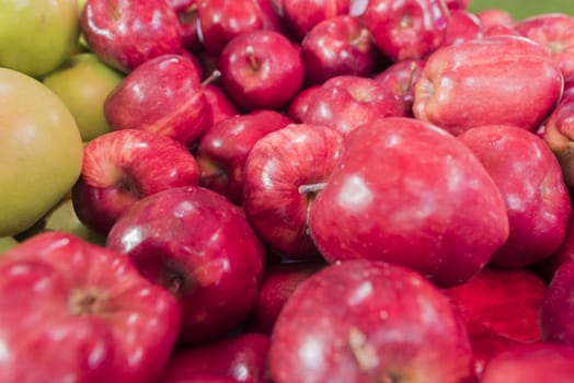 Close up fresh red apple at market