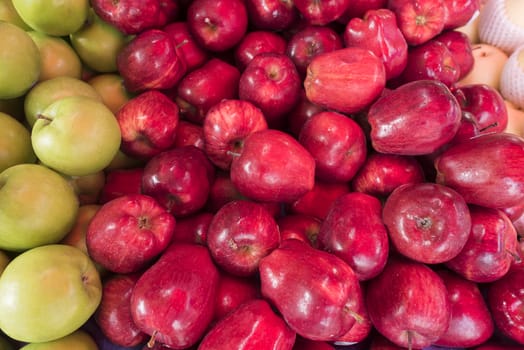 Close up fresh red apple at market