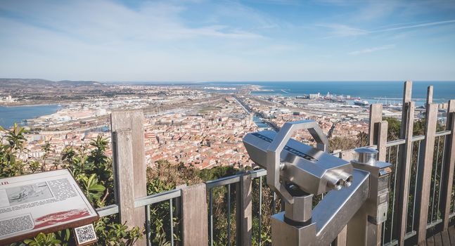 Sete, France - January 4, 2019: View of a public telescope on Mount St. Clair overlooking the town of Sete on a winter day