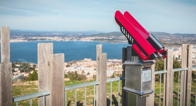 Sete, France - January 4, 2019: View of a public telescope on Mount St. Clair overlooking the town of Sete on a winter day
