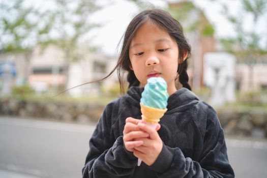 Asian Child Eating Ice Cream