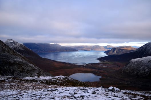 Mountain lake and bay visible from the top of the mountain in Northern Norway