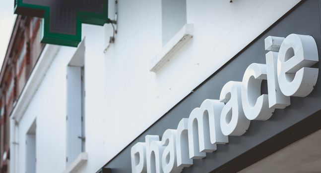 Noirmoutier, France - July 3, 2017: front of a pharmacy in the city center on a summer day