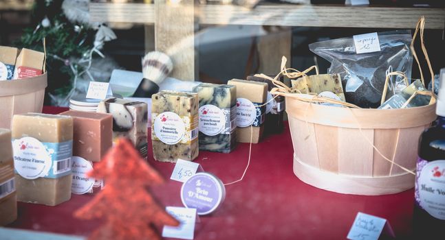 Sete, France - January 4, 2019: Showcase of a local cometic products store and soap on a winter day