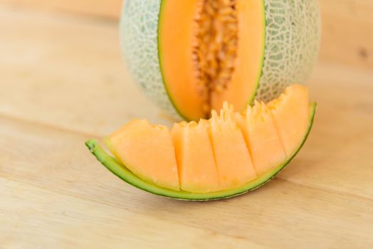 Fresh orange melon in greenhouse