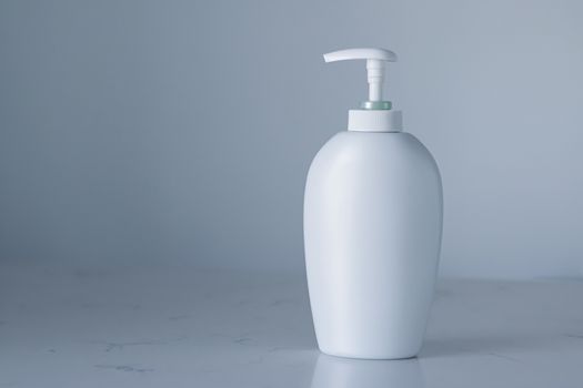 Blank label cosmetic container bottle as product mockup on gray background, hygiene and healthcare