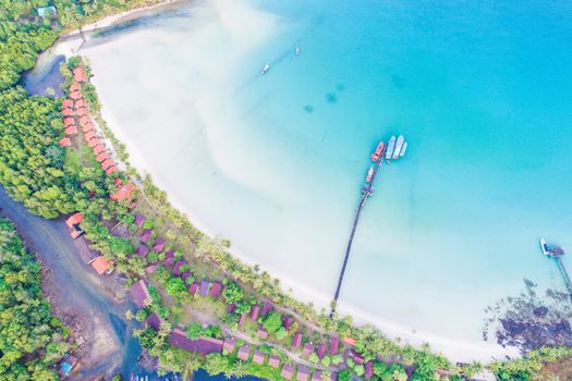 Aerial sea view of beautiful curve beach with wooden pier blue ocean