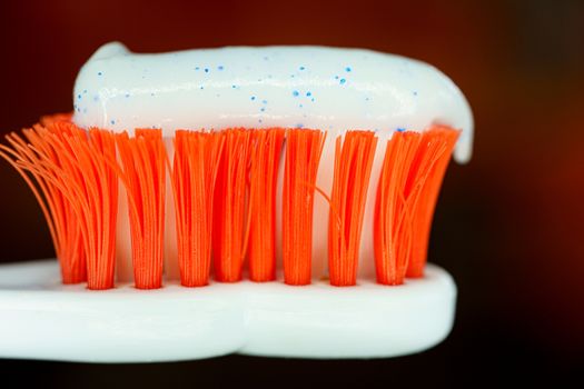 Toothbrush with toothpaste. Close up view with selective focus
