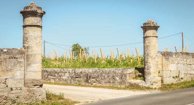 Saint Emilion, France - May 26, 2017: stone portal of the Chateau Cadet Piola on a spring day. Prodution of a grand cru wine from the Saint Emilion vineyard