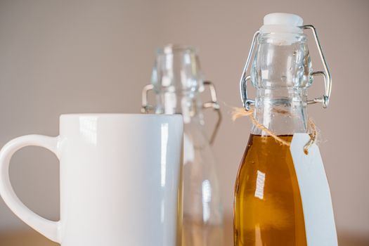 Close up view of glass bottle with a blank tag of apple juice or cider