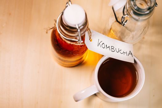 Handwritten label on a bottle of homemade Kombucha. It is a fermented drink made from tea and lemon, produced using culture SCOBY