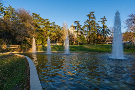 Atena's Park fountains with the Almudena Cathedral on the backgroung in Madrid, Spain.