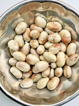 Jackfruit seeds are dried and kept in a bowl for using as a ingredient for preparing lunch