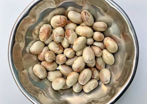 Jackfruit seeds are dried and kept in a bowl for using as a ingredient for preparing lunch