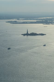 Liberty island and Statue of Liberty aerial photo at blue hour, sunset time