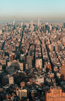 Sunset aerial view of New York City looking over midtown Manhattan towards uptown. teal and orange style