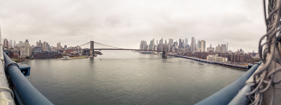 New York City Manhattan skyline panorama with Brooklyn Bridge. View from Manhattan Bridge