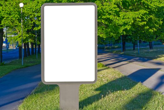 billboard on a background of green nature. suitable for advertising. Blank billboard and outdoor advertising. Mockup poster outside