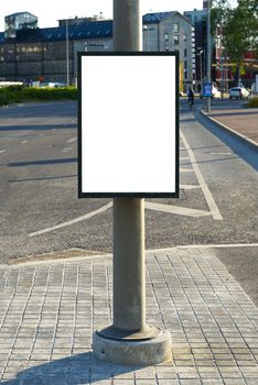 Blank billboard and outdoor advertising. Mockup poster outside. Trash in the city on a lamppost, a place for advertising Tallinn, Estonia