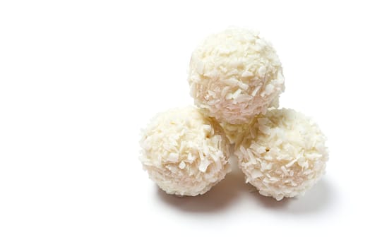 Homemade White Candy With Coconut Topping On White Background. copy space