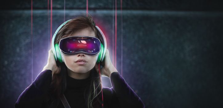 Young woman in glasses virtual reality goggles and headphones. VR headset and technology augmented reality concept.