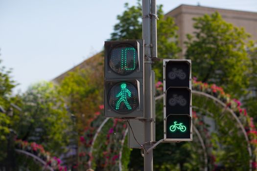 Pedestrian and bicycle traffic lights. Green light is on.