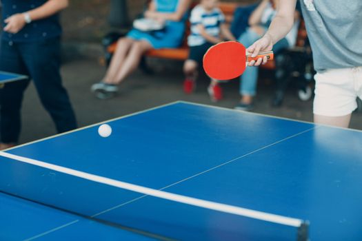 Table for ping pong and player with racket