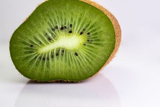 Macro shot of a kiwi slice. Healthy food.