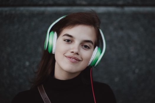 Web radios music concept. Young pretty girl listening music with headphones.