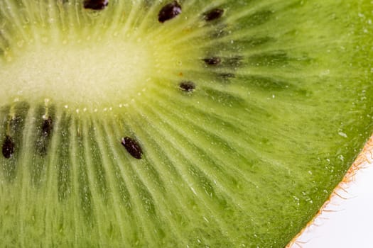 Macro shot of a kiwi slice. Healthy food.