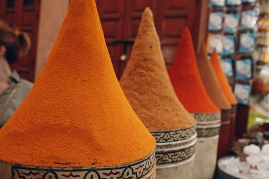 Bright multicolored red and orange spices in oriental bazaar