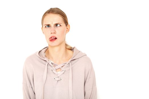 Funny facial expressions of a young woman isolated white background