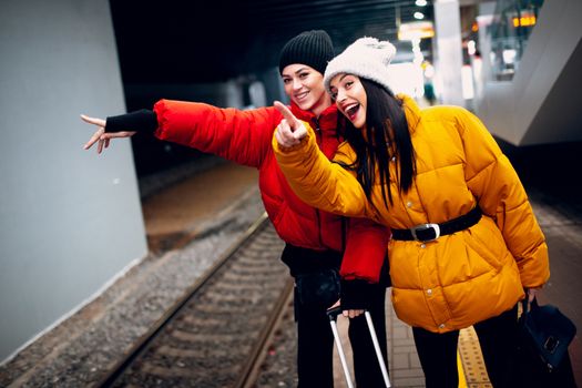 Two young women and train