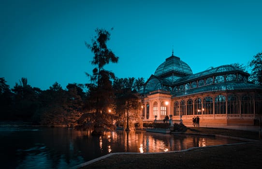 Night view of Crystal Palace or Palacio de cristal in Retiro Park in Madrid, Spain. The Buen Retiro Park is one of the largest parks of the city of Madrid, Spain