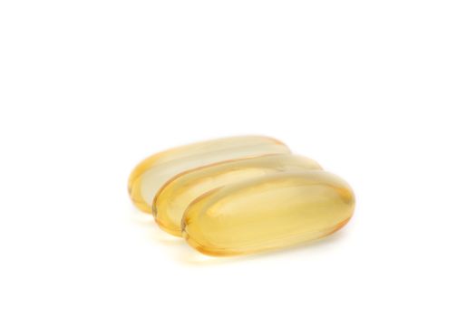 Fish oil capsules closeup isolated on white background
