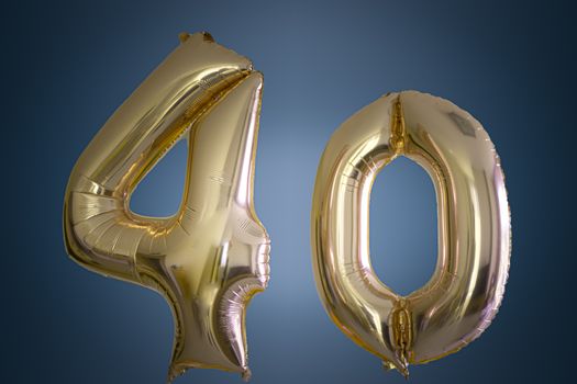 Isolated pink gold Helium Balloon in the shape of the number 40. Suitable for forty years celebration or anniversary , 40 billboard or 40 percent discount.