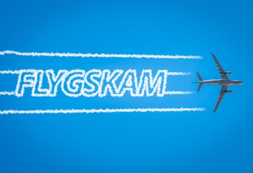 Airplane leaving jet contrails with Flygskam word inside.Flygskam or flight shame in Swedish refers to the feeling of being ashamed or embarrassed to board a plane because of its negative impact on the environment.