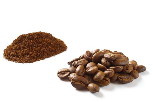 Pile of coffee beans and powdered coffee isolated on white background. close-up