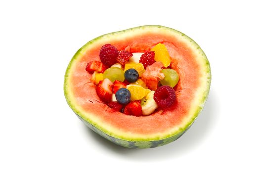Watermelon filled with fresh fruit salad. isolated on white background.