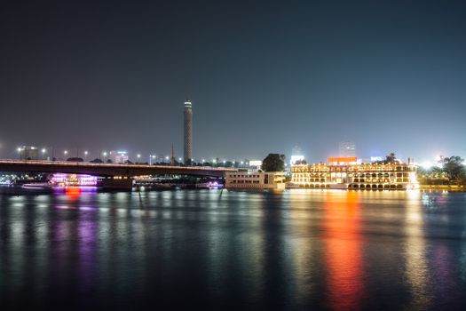 Cairo city center and Nile river at night, long exposure with smoothed out water.