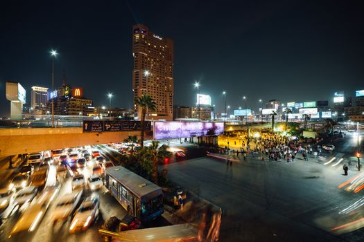 Cairo, Egypt - November 8, 2018: The busy Abdel Munim Riad square and bus station in central Cairo at night.