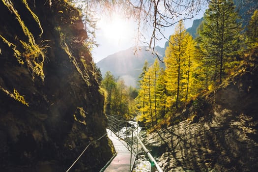 The footbridge of the Leukerbad themal springs (Dala gorge) during fall.