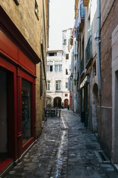 Narrow streets of the ancient city of Pezenas, France.