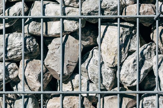 Welded mesh gabion willed with gabion stones.