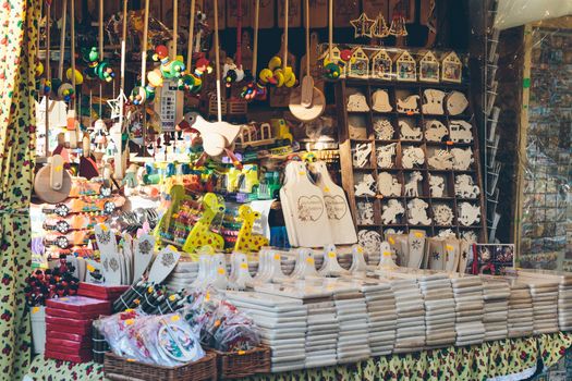 Krakow, Poland - December 30, 2017: Kiosk selling hand crafted wooden toys and souvenirs at a Christmas market in Krakow.