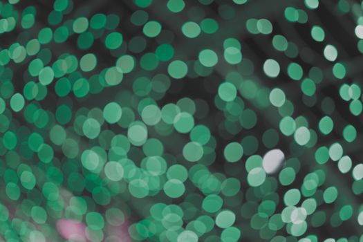 Deep forest green beautiful blurred bokeh background. Glitter yellow light spots defocused. Suitable for copy space and background textures