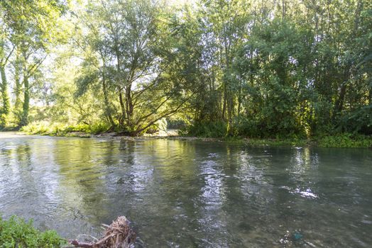 black river that flows into the polymer dam in summer