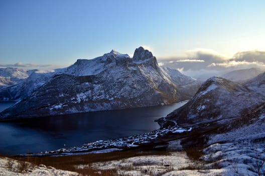 Norway fjord with beautiful snowy mountains around 